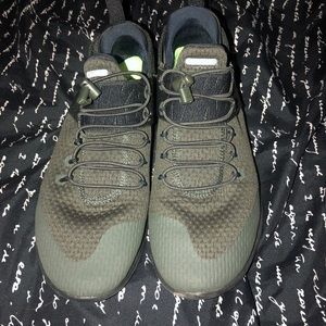 Olive green and black Nike slip on shoes